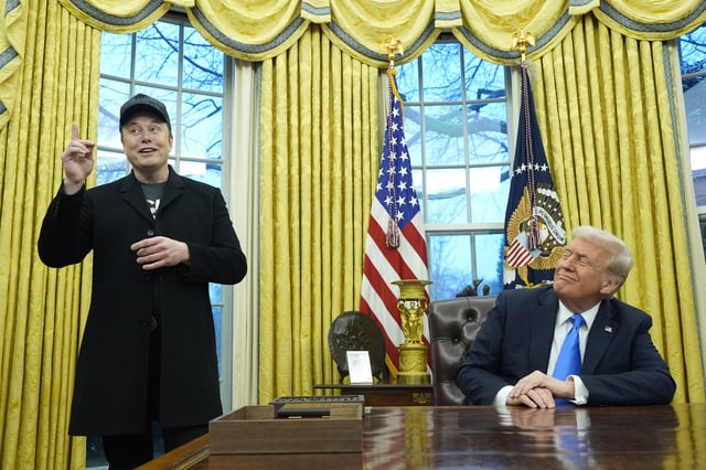 President Donald Trump listens as Elon Musk speaks in the Oval Office at the White House, Tuesday, Feb. 11, 2025, in Washington. 