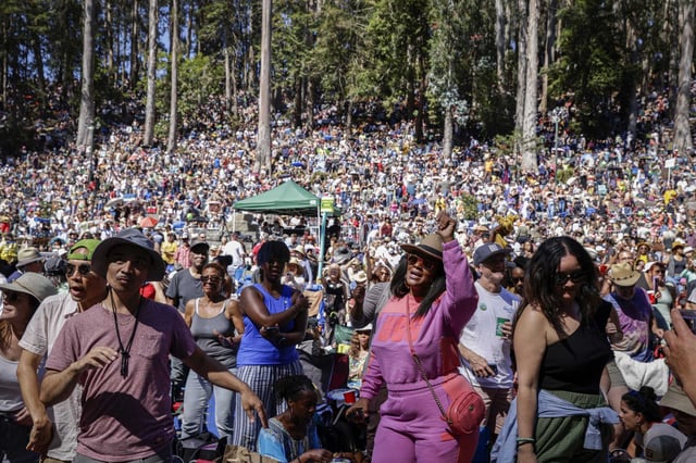 Thousands of attendees dance during the final day of Stern Grove Festival in San Francisco on Aug. 25, 2024. The organizers of San Francisco’s beloved free summer concert series introduced a revamped ticketing system in response to feedback from festivalgoers, as the event looks to reduce the stress often associated with securing tickets.