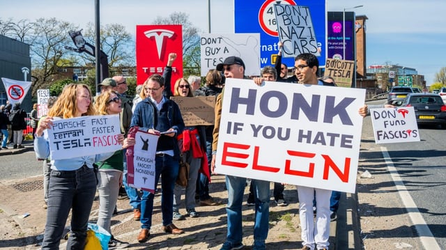 Protesters outside a Tesla showroom in Park Royal, London
