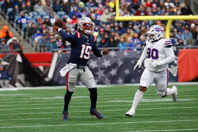 Joe Milton III #19 of the New England Patriots passes the ball for a touchdown to teammate Kayshon Boutte #9 (not pictured) against the Buffalo Bills as he makes his NFL debut during the second quarter.