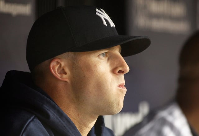 Former New York Yankees outfielder Brett Gardner looks on from the bench during the game against the Tampa Bay Rays at Yankee Stadium on May 10, 2012 in New York City.