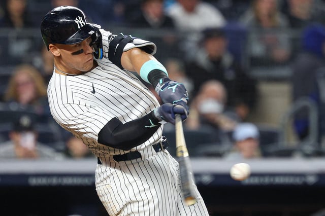 Apr 3, 2025; Bronx, New York, USA; New York Yankees center fielder Aaron Judge (99) doubles during the sixth inning against the Arizona Diamondbacks at Yankee Stadium. Mandatory Credit: Vincent Carchietta-Imagn Images