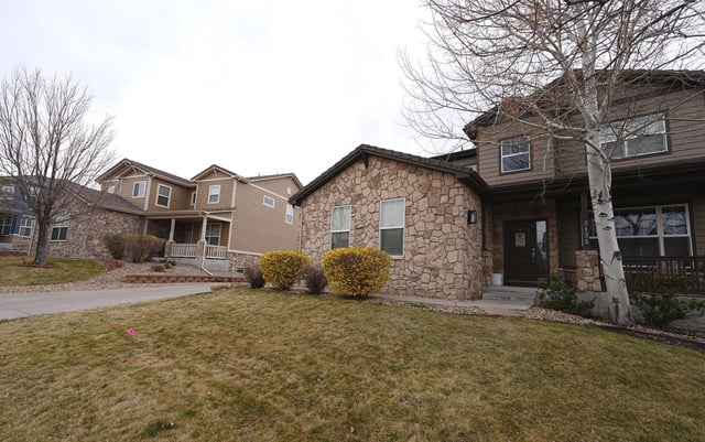 An image of the home, right, in which Kristi Krug was found stabbed and beaten to death taken April 1, 2025, in Broomfield, Colo. (AP Photo/David Zalubowski)