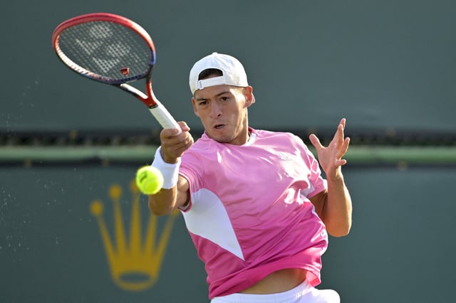 Mar 6, 2025; Indian Wells, CA, USA;  Sebastian Baez (ARG) hits a shot during first round match against Matteo Gigante (not pictured) in the BNP Paribas Open at the Indian Well Tennis Garden. Mandatory Credit: Jayne Kamin-Oncea-Imagn Images/File Photo