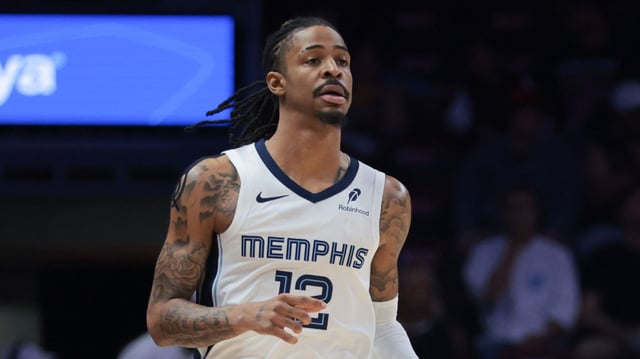 Memphis Grizzlies guard Ja Morant dribbles the basketball against the Miami Heat during the first quarter at Kaseya Center in Miami, Florida, on Thursday, April 3, 2025.