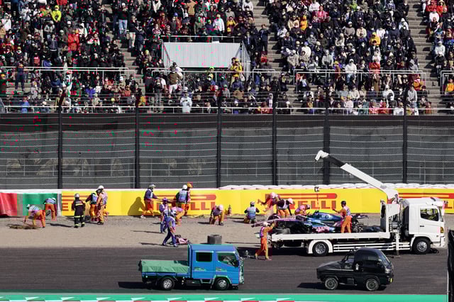 Formula One F1 - Japanese Grand Prix - Suzuka Circuit, Suzuka, Japan - April 4, 2025 The car of Alpine's Jack Doohan is towed away by marshals after his crash during practice REUTERS/Issei Kato