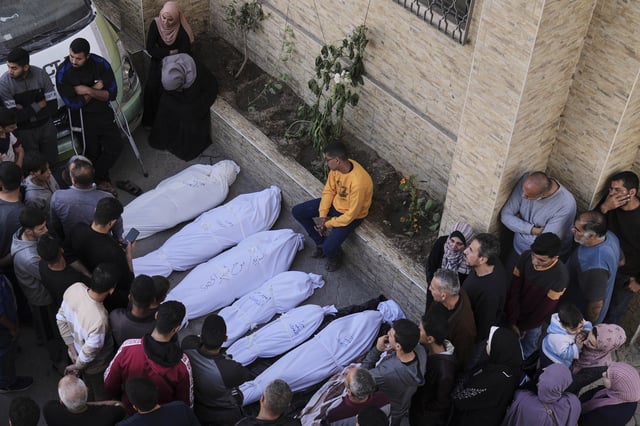Palestinians grieve over the bodies of their relatives, who were killed in an Israeli airstrike, at the Baptist Hospital in Gaza City, on Thursday, April 3, 2025. (AP Photo/Jehad Alshrafi)