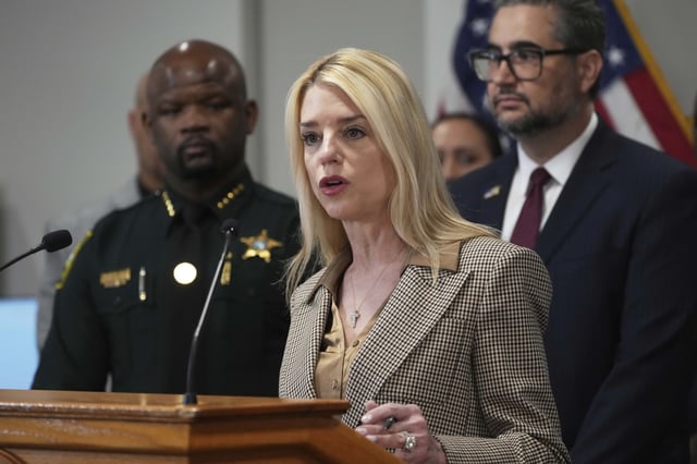 U.S. Attorney General Pam Bondi announces the arrest of gang members involved in four homicides, Friday, April 4, 2025, in Fort Lauderdale, Fla. (AP Photo/Marta Lavandier)
