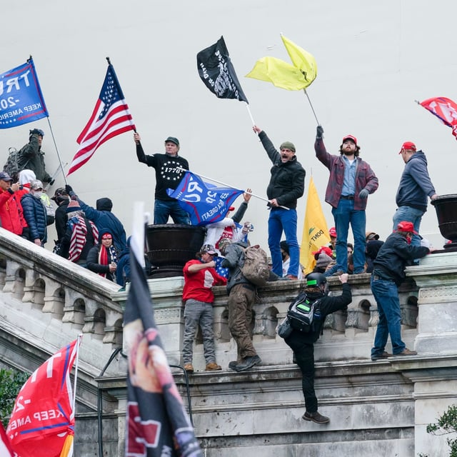 FILE - Rioters wave flags on the West Front of the U.S. Capitol in Washington on Jan. 6, 2021. (AP Photo/Jose Luis Magana, File)