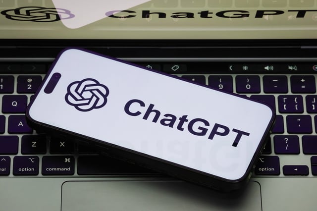Stock image: A close-up of a smartphone displaying the ChatGPT logo on a white screen, with the same ChatGPT logo shown on a laptop screen on February 19, 2025 in Chongqing, China.