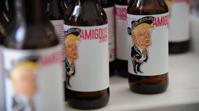 View of Amigous Craft Beer (Double England IPA type with mango fruit) which bottle shows an image of US President Donald Trump wearing a Mariachi costume, in Mexico City, on June 15, 2017.