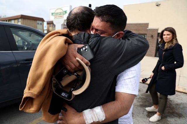 Venezuelan migrant brothers Jose Gregorio Gonzalez, black shirt, and Alfredo Pacheco, with mask, are reunited in Broadview after Gregorio Gonzalez was released from ICE custody to donate his kidney for his brother, April 4, 2025. Alfredo Pacheco was diagnosed with end-stage kidney failure earlier this year. (Antonio Perez/Chicago Tribune)