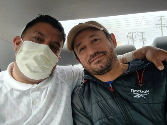 José Alfredo Pacheco, left, with his brother José Gregorio González.
