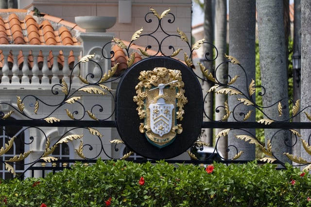 The family crest is displayed on the gate of the Trump International Golf Club, Friday, April 4, 2025, in West Palm Beach, Fla. (AP Photo/Alex Brandon)