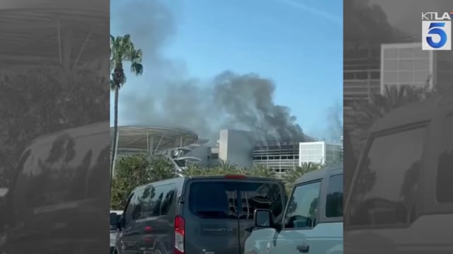 A car caught fire in Disneyland’s Pixar Pals parking structure Friday morning, April 4, and spread to other vehicles. (Photo by KTLA)