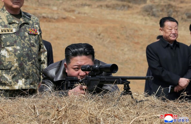 Images released by state media showed Kim peering through the scope of a sniper rifle on a visit to special forces