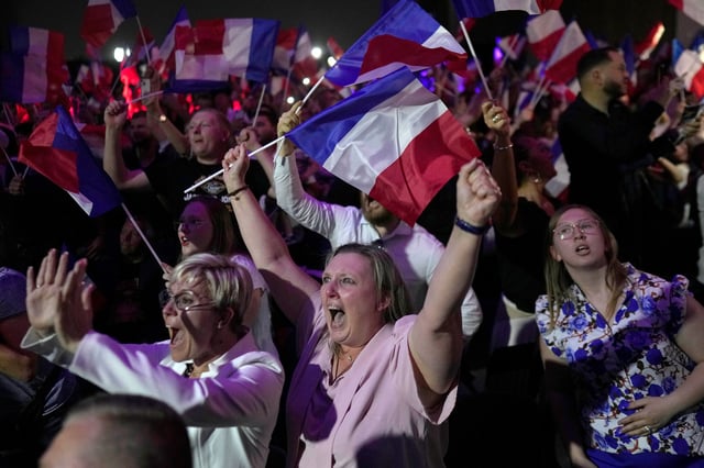 Le Pen supporters in Henin-Beaumont react to France's first-round election results in June 2024.