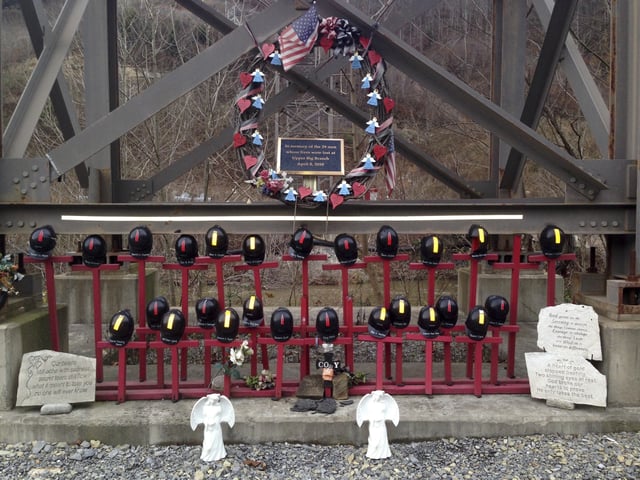 FILE - A memorial to 29 miners killed in a 2010 explosion stands at the entrance to the Upper Big Branch mine in Montcoal, W.Va., Dec. 3, 2015. (AP Photo/John Raby, File)