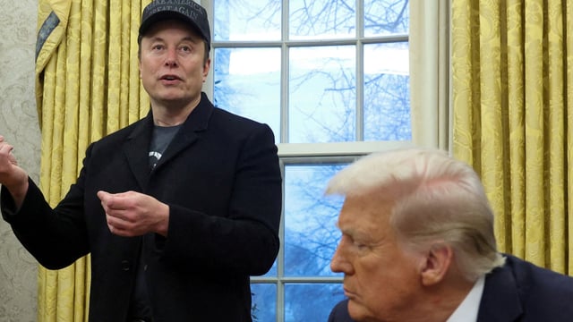 Elon Musk speaks as US President Donald Trump listens in the Oval Office of the White House in Washington, D.C., on February 11, 2025. 