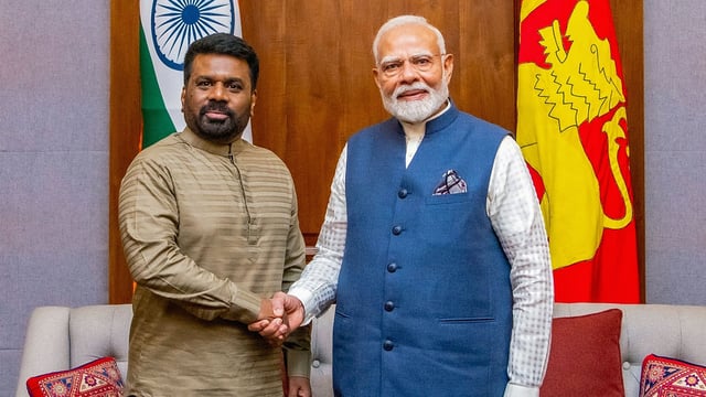 In this handout photograph taken on April 5, 2025 and released by Sri Lanka's President office, Sri Lanka's President Anura Kumara Dissanayake (L) shakes hands with India's Prime Minister Narendra Modi after a bilateral meeting at the president's office in Colombo. 