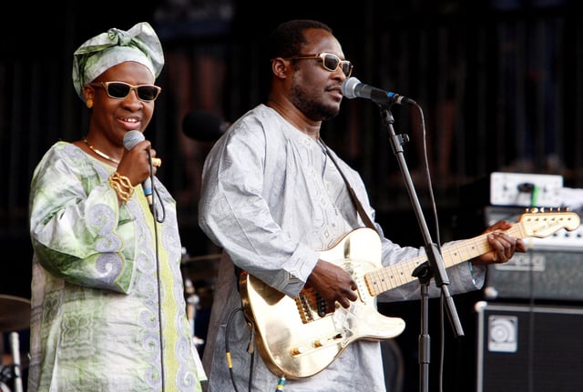 Blind Malian duo Amadou & Mariam comprising Mariam Doumbia (L) and Amadou Bagayoko perform at the Glastonbury Festival 2009 in south west England June 28, 2009.   REUTERS/Luke MacGregor/File Photo