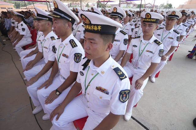 Chinese navy officers attend an official inauguration of the Ream Naval Base in Sihanoukville, southwestern of Phnom Penh, Cambodia, Saturday, April 5, 2025. (AP Photo/Heng Sinith)
