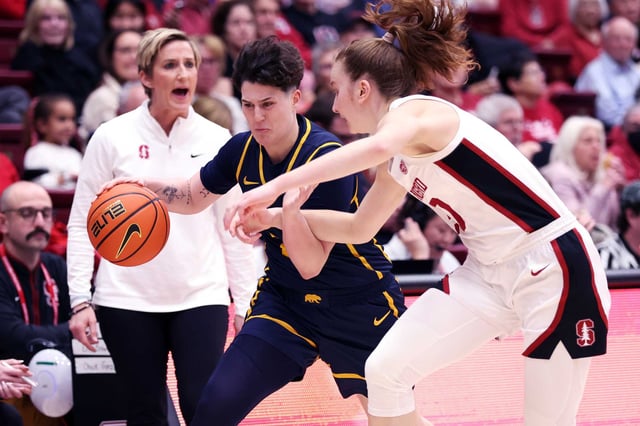 Cal’s Ioanna Krimili drives against Stanford’s Elena Bosgana as Cardinal head coach Kate Paye watches in the second quarter at Maples Pavilion on Jan. 23. 