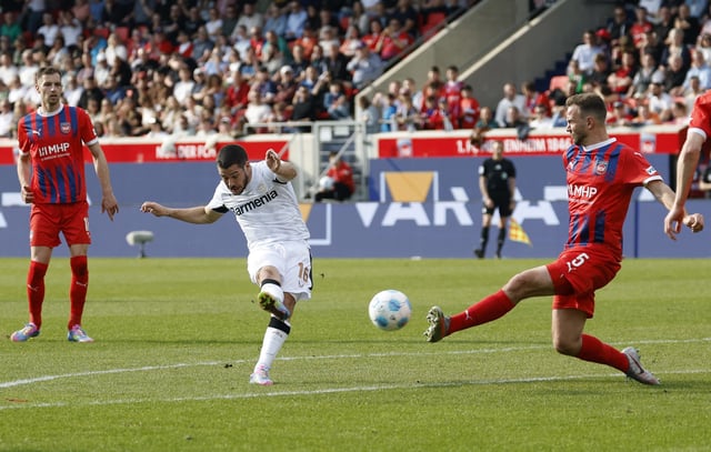 Soccer Football - Bundesliga - 1. FC Heidenheim v Bayer Leverkusen - Voith-Arena, Heidenheim, Germany - April 5, 2025 Bayer Leverkusen's Emiliano Buendia scores their first goal REUTERS/Heiko Becker