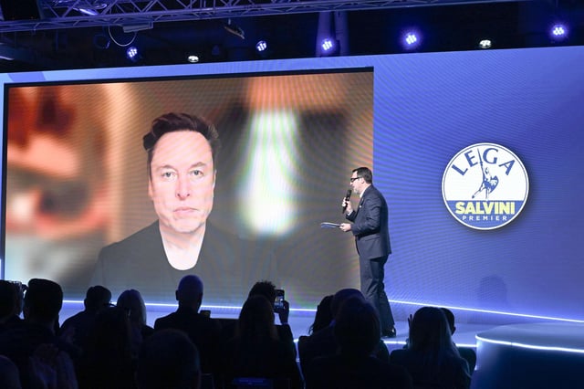 Elon Musk speaks via video link with Matteo Salvini, leader of the Lega per Salvini Premier party, during the Lega party federal congress in Florence, Italy, on April 5, 2025.