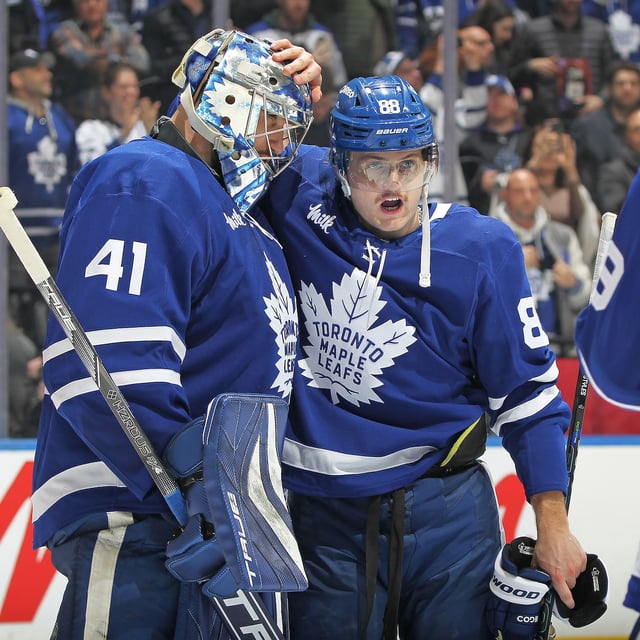 William Nylander (88) of the Toronto Maple Leafs congratulates teammate Anthony Stolarz (41) on victory against the Columbus Blue Jackets in an NHL game at Scotiabank Arena on April 5 in Toronto.