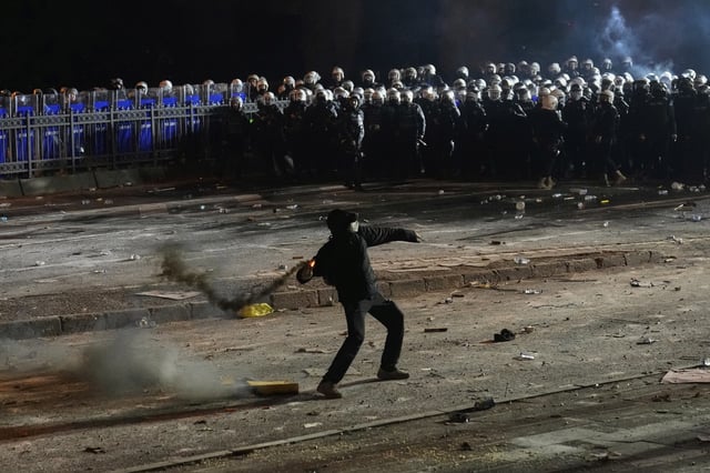FILE - A protester throws a firework during a protest against the arrest of Istanbul's Mayor Ekrem Imamoglu, in Istanbul, Turkey, Saturday, March 22, 2025. (AP Photo/Khalil Hamra, File)