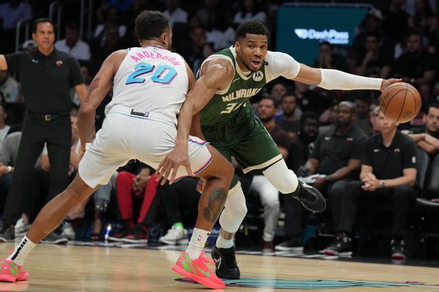 Apr 5, 2025; Miami, Florida, USA;  Milwaukee Bucks forward Giannis Antetokounmpo (34) drives past Miami Heat forward Kyle Anderson (20) during the second half at Kaseya Center. Mandatory Credit: Jim Rassol-Imagn Images