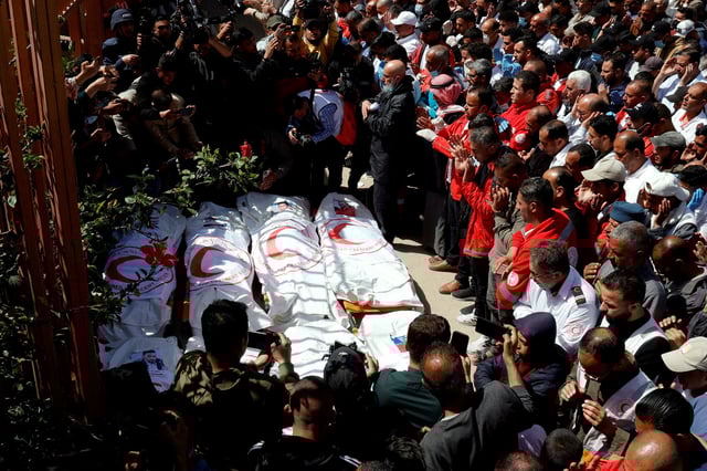 Palestinians mourn medics, who came under Israeli fire while on a rescue mission, after their bodies were recovered, according to the Red Crescent, at Nasser hospital in Khan Younis in the southern Gaza Strip March 31, 2025. REUTERS/Hatem Khaled/File Photo