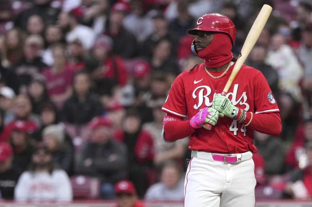 Cincinnati Reds shortstop Elly De La Cruz rests a torpedo-shaped bat on his shoulder between pitches during a fourth-inning at-bat against the Texas Rangers on Tuesday in Cincinnati. Using the bat the previous night, De La Cruz had four hits and seven RBIs.