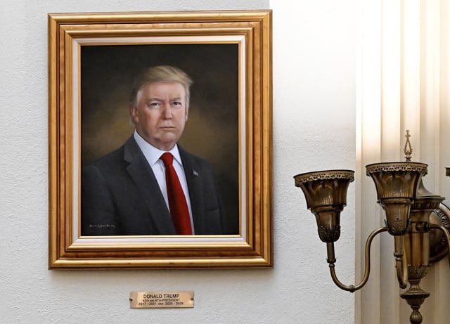 A portrait of President Donald Trump hangs on a wall in the rotunda on the third floor of the Colorado Capitol, Monday, March 24, 2025, in Denver.