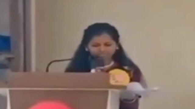 Varsha Kharat, a 20-year-old student, moments before collapsing during her speech at a college event.
