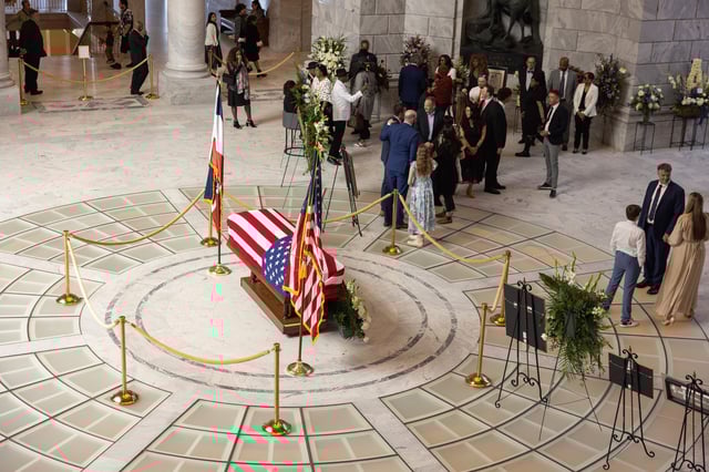 Attendees pay their respects during a funeral service for former U.S. Rep. Mia Love, Sunday, April 6, 2025, in Salt Lake City. (AP Photo/Melissa Majchrzak)