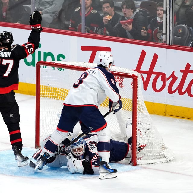 Ottawa Senators' David Perron (57) celebrates his goal on Columbus Blue Jackets goaltender Elvis Merzlikins (90) during third period NHL hockey action in Ottawa, on Sunday, April 6, 2025. THE CANADIAN PRESS/Justin Tang