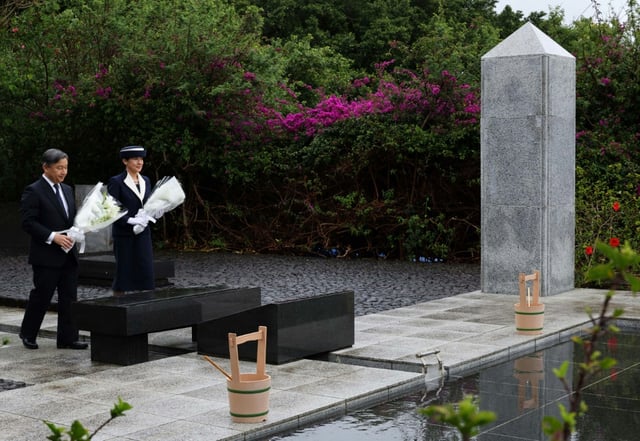 The royal couple offered flowers at a memorial for the war dead in Iwo Jima