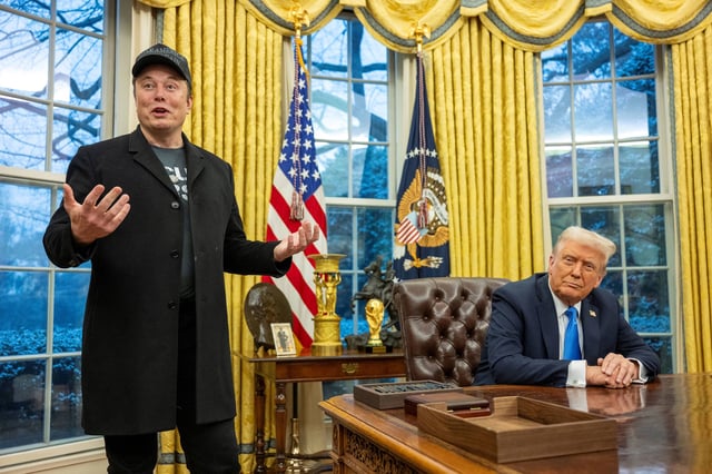 Elon Musk speaks as President Donald Trump looks on in the Oval Office of the White House in Washington, DC, on February 11.