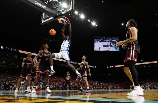 Apr 5, 2025; San Antonio, TX, USA; Duke Blue Devils center Khaman Maluach (9) dunks against the Houston Cougars during the second half in the semifinals of the men's Final Four of the 2025 NCAA Tournament at the Alamodome. Mandatory Credit: Bob Donnan-Imagn Images
