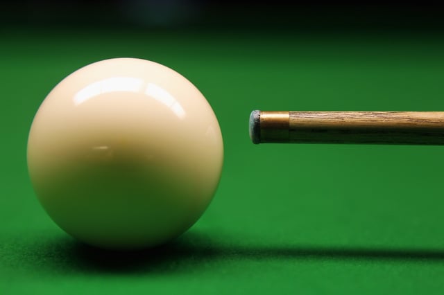 A player prepares to strike the white ball with their cue in this archive image taken at Wembley Arena on January 15, 2011, in London, England.
