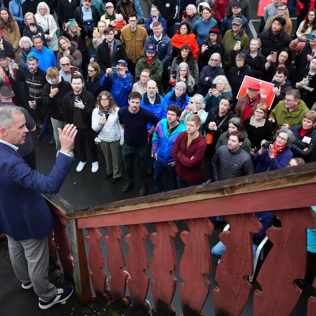 Liberal leader Mark Carney speaks to a crowd outside that weren't able to get into his event due to capacity, before a meet and greet at the Victoria Edelweiss Club In Victoria, B.C., on Sunday, April 6, 2025. THE CANADIAN PRESS/Sean Kilpatrick