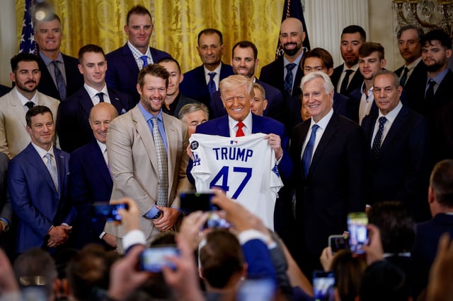 Los Angeles Dodgers pitcher Clayton Kershaw, President Donald Trump and Los Angeles Dodgers Owner and Chairman Mark Walter pose with a jersey presented to Trump as he hosts the 2024 World Series champions in the East Room of the White House on April 7 in Washington, DC.