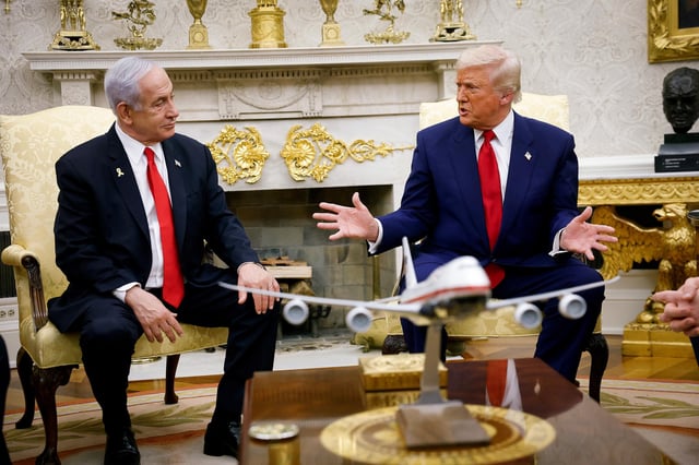 President Donald Trump, accompanied by Israeli Prime Minister Benjamin Netanyahu, speaks during a meeting in the Oval Office of the White House on April 7, in Washington, DC.