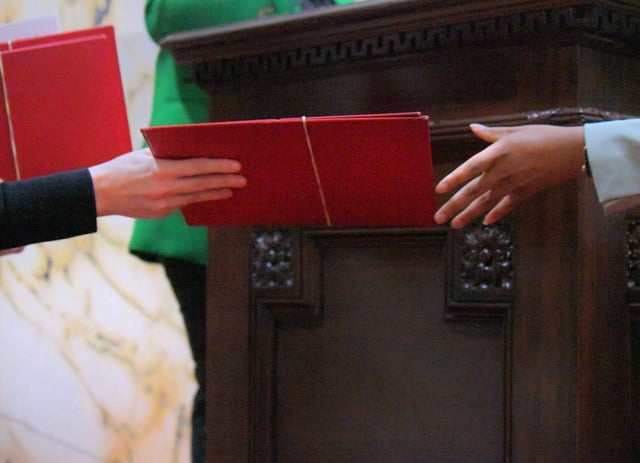 Folders containing bills and state senate documents pass hands during the final day of the 2025 legislative session at the Maryland State House. (Karl Merton Ferron/Staff)