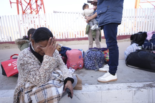 FILE - Maria Mercado, who is from Colombia but arrived from Ecuador, gets emotional as she sees that her 1 p.m. appointment was canceled on the U.S. Customs and Border Protection (CBP) One app, as she and her family wait at the border crossing in Tijuana, Mexico, Jan. 20. 2025. (AP Photo/Gregory Bull, File)
