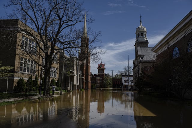 Buildings in a flooded downtown area are seen on Monday, April 7, 2025, in Frankfort, Ky. (AP Photo/Jon Cherry)
