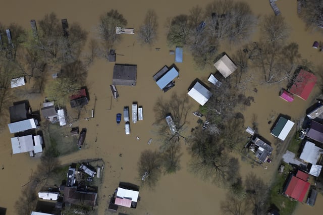 Camp Turn-A-Bout is flooded by the rising Ohio River at the Gunpowder Creek, Monday, April 7, 2025, in Union, Ky. (AP Photo/Carolyn Kaster)