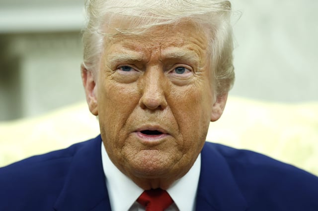U.S. President Donald Trump answers a reporters question in the Oval Office of the White House on April 7, 2025 in Washington, DC.